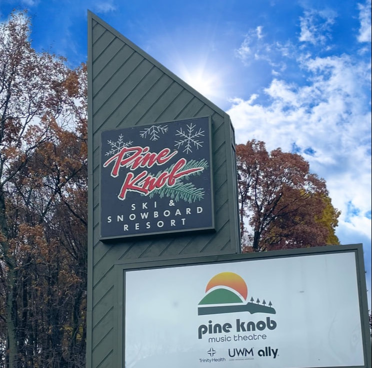 Picture of the Pine Knob Ski and Snowboard Resort sign at the entrance of our property where guests come to visit.